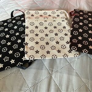 Fashion Nova Black and Cream Star Pattern Bags
